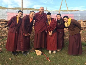 Wangdrak Rinpoche with nuns and their new polytunnel