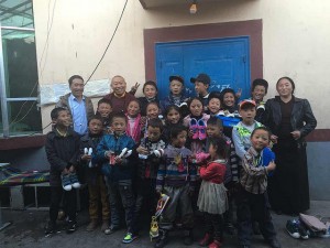 The children with their carers at home in Yushu. 